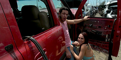 Attractive brunette riding a young stud in the car