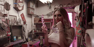 Busty MILF with huge boobs using the glass sex toy