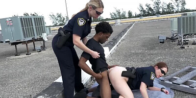 Two chubby female cops fucking with a black man on the roof