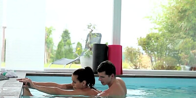 European couple becomes excited and makes love in the pool