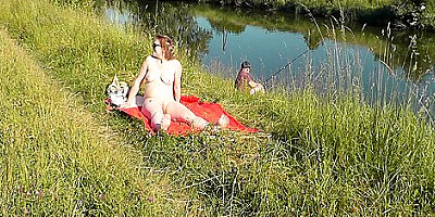 Wild Beach. Sexy Milf Platinum Naked Sunbathing On River Bank, Random Fisherman Guy Watches. Naked In Public. Nude Beach