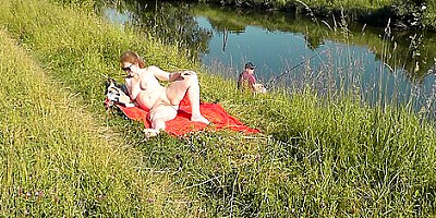 Wild Beach. Sexy Milf Platinum Naked Sunbathing On River Bank, Random Fisherman Guy Watches. Naked In Public. Nude Beach
