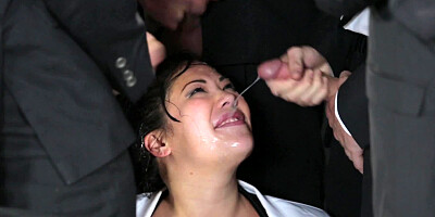 A hot little bitch is getting several men to cum on her