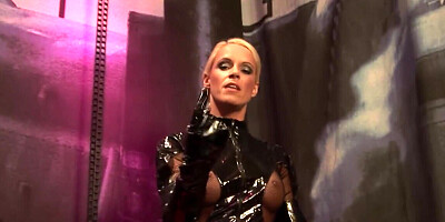 Prostitute in latex does it with a vibrator