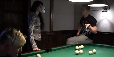Two horny guys are sucking tits of a charming brunette