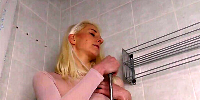 Stimulating her clitoris while getting wet in the shower