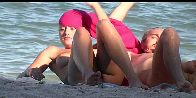 Shameless nudist babes tanning on the beach for spy cam