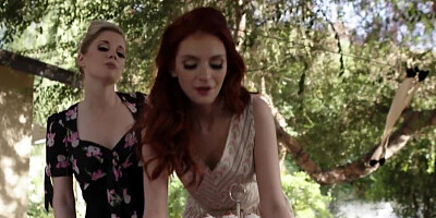 Charlotte Stokely and Maya Kendrick licking while outside