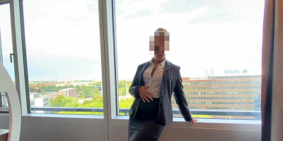 Boss bangs secretary in front of the window