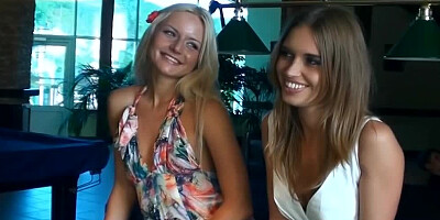 Skinny women are filmed making a picnic together and licking