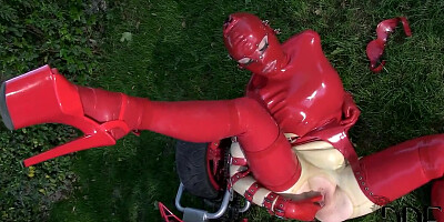 Latex Lucy in latex suit is fingering cunt