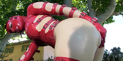 Latex Lucy in latex suit is fingering cunt