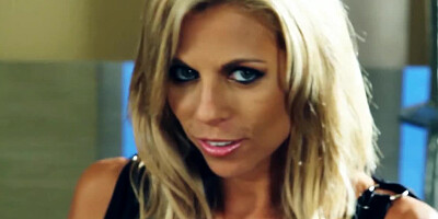 A blonde with big boobs is teasing her hot body before us all