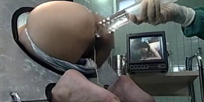 Hot milf is a Japanese AV Model in bondage for ass insertion