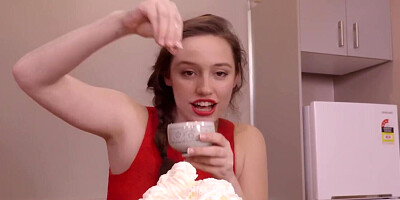 Unshaven brunette getting covered in whipped cream
