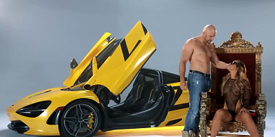Owner of round booty analyzed by bald bruiser near luxury car