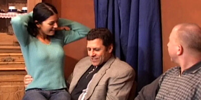 Brunette girl taking two old man