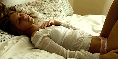 Angelika masturbating on a bed
