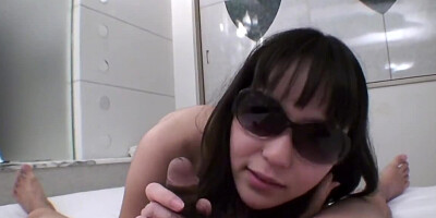 Shy Japanese belle with sunglasses sucks dick on the camera