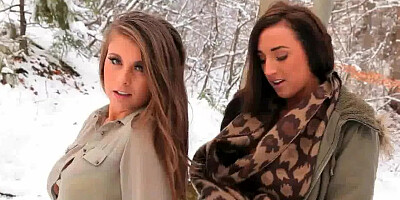 Girls in stockings pose in the snow