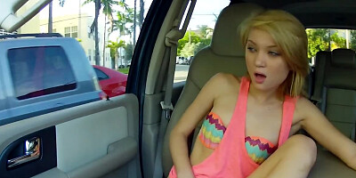 Petite blonde girl is having genital interaction in the car