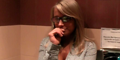 A busty bimbo is fucked in a public restroom by a kinky dude
