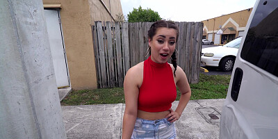 A brunette is given cash to shake her ass in front of the camera