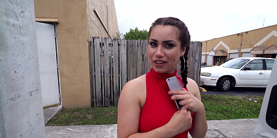 A brunette is given cash to shake her ass in front of the camera