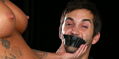 Two ladies are playing with a strap on in the kinky and arousing video