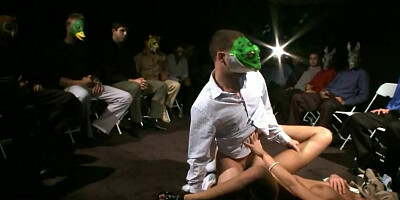 Creep in a frog mask fucks her pussy savagely on the runway