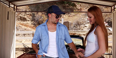 A redhead is on top of a car, getting her pussy ravaged deeply