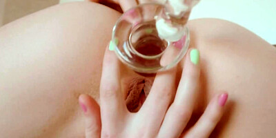 Dirty blonde stretches her asshole with a glass toy