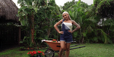Kona Jade blows a lucky gardener and rides his cock
