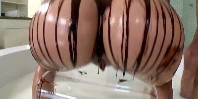 Blonde covers herself and her man in chocolate. She eats cum as well