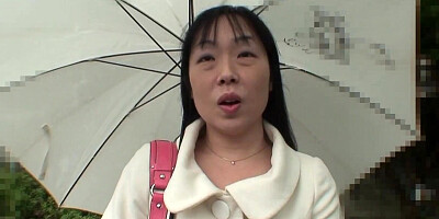 An unconventional Asian woman engages in sexual activity after using a sex device on her pubic area.