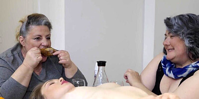 Multiple older women are playing with one lesbian teen