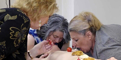 Multiple older women are playing with one lesbian teen