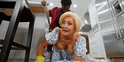 Naughty black man fucks girlfriend's mom in the kitchen