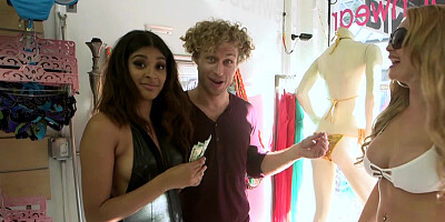 Blonde and Latina give blowjob and get fucked in clothing store