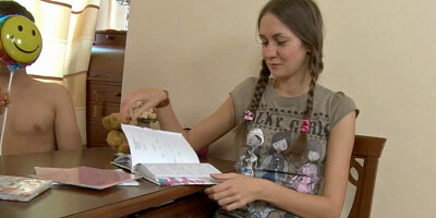 A brunette gets cum on her face while she is studying with her man