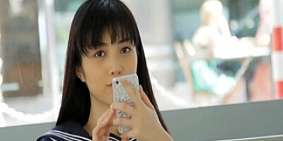 Asian looks beautiful so she poses on the camera