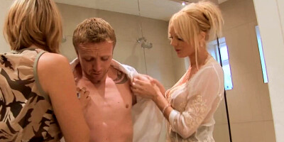 Two blonde milfs with fake tits and in sexy lingerie are enjoying an intense threesome in the shower