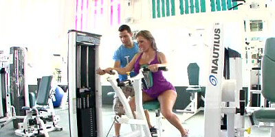 A busty woman is in the gym and she is getting her tight ass licked