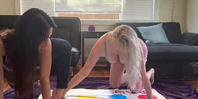 Two hot lesbians are playing a strip twister game