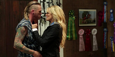 A sexy bimbo with large tits gets some love from behind