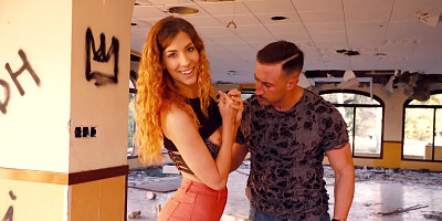 Foxy girl blows her horny man in an abandoned building