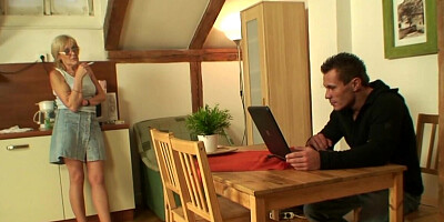 Mature blonde woman with a shaved pussy gives a BJ