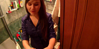 Horny dude is filming this shy chick in the bathroom