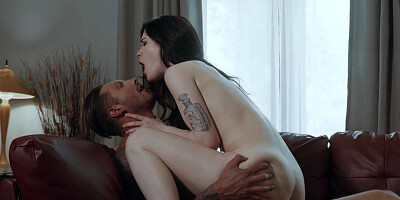 Evelyn Claire pleasuring her lover on leather couch