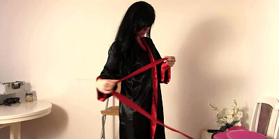 Eileen Sue is a smoldering hot brunette and she is putting on a striptease show for us